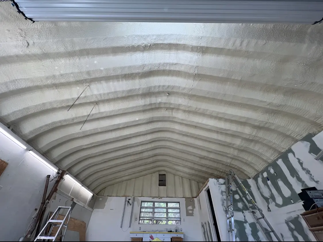 Spray polyurethane foam applied to the underside of a metal roof deck in Innsbrook